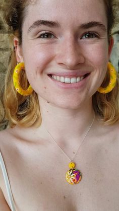 Sunflower yellow with the cutest ditsy daisies hand painted all over them - these hoops are some of the most adorable I’ve made!Handmade in the countryside near Bristol using polymer clay and stainless steel studs. These earrings are lightweight (even the largest size!) meaning you can enjoy them all day without any discomfort. Each pair in individually handmade so will differ slightly from the photographs.Available in 3 sizes:Large ~ 5cmRegular ~ 3cmTiny ~ 1cmThese statement earrings are made f Cute Yellow Resin Jewelry, Everyday Yellow Polymer Clay Jewelry, Yellow Small Hoop Jewelry For Everyday, Everyday Small Hoop Yellow Jewelry, Everyday Small Yellow Hoop Jewelry, Yellow Flower-shaped Polymer Clay Earrings, Whimsical Yellow Jewelry With Ear Wire, Yellow Small Hoop Earrings For Summer, Summer Yellow Hoop Jewelry