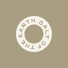 a white circle with the words earth say why? in it on a brown background