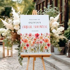 an easel with a sign that says welcome to the bridal shower