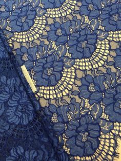 an image of blue lace with flowers on it