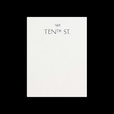 a white sheet with the words tenth st printed on it in black ink, against a dark background