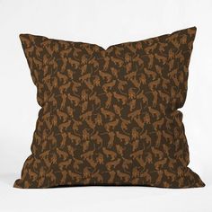 a brown pillow sitting on top of a white surface