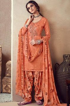 Look fabulous and beautiful by wearing this Dusty Peach Cotton Patiala Suit which surely deserves a special place in your wardrobe. This U neck and Quarter Sleeves clothe prettified with resham, zari and stone work. Available with Cotton Patiala Salwar in Dusty Peach Color with Dusty Peach Chiffon Dupatta. Latest Designer Sarees