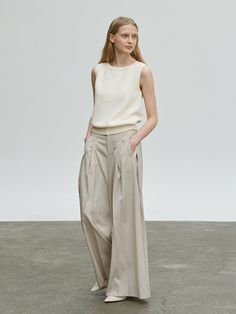 Editor's NotesCarriere's classic design makes Cotton Wave Knit Top a perfect item to create both casual and formal looks.- Wool Blend Wide Pants- Wide pants with blend wool texture- Modern silhouette for luxurious and feminine mood- Minimal seamless silhouette- Front wrinkle point detail - Modern classic designMeasurements (in.)- Size S/M- Length: 39.8in./40.2in.- Waist: 14.2in./15.0in.- Hip: 18.5 in./19.3in.*Model Info: height 5'6 / bust 31.9in. / waist 24.0in. / hips 33.9 in. Composi Elegant Fitted Cashmere Bottoms, Elegant Wool Wide Leg Ankle-length Pants, Elegant Wool Wide Leg Pants For Spring, Cashmere Trousers For Work, Elegant Wide Leg Wool Pants For Spring, Elegant Beige Dress Pants For Fall, Elegant Wool Beige Bottoms, Elegant Beige Wool Bottoms, Chic Beige Wool Pants