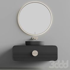 a round mirror on top of a black dresser next to a wall mounted light fixture