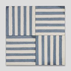 two blue and white striped tiles on a gray background, each with different horizontal stripes