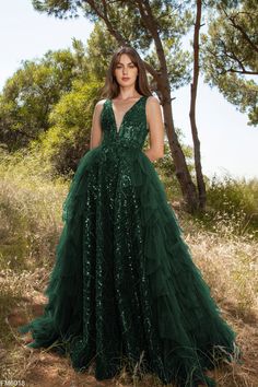 The Azzure Couture FM6018 evening dress is a timeless classic. With a deep v neckline and open v back, this dress is both stylish and flattering. It is elegantly adorned with beaded sequin detail and a ruffle overskirt for a truly luxurious look. The A-line silhouette is an elegant, versatile choice for formal occasions. Green Fairytale Dress, Emerald Wedding Dresses, Azzure Couture, Beautiful Wardrobe, Dream Prom Dress, Real Star, Plastic Dress, Dream Prom, Green Gown