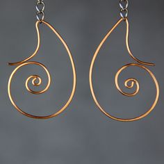 "The scroll hoop earrings are handmade using copper wire. Perfect gift for any occasion! Free U.S shipping! Anni Designs. Customers who purchased this item said: \" Gorgeous earrings. Easy to wear and look good with any outfit. \" \"So lovely! They fit beautifully while not getting in the way of hats etc. LOVE! \" \"So lovely, thank you! Also really like the special gift, earrings - thank you\" It is inspired by Rococo style. Rococo style is elegant, ornate and use a lot of curves. It is playful Abstract Jewelry, Infinity Earrings, Turquoise Hoop Earrings, Abstract Earrings, Style Français, Dog Earrings, Earring Handmade, Spiral Earrings, Etsy Bridesmaid Gifts