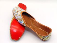 Robust, hand-stitched shoes in the classic Indian/Pakistani style, including a genuine leather sole and an inside leather-padded cushion. Beautiful sequence work and pearls adorned with zardozi and rhinestones in a flower pattern surround the light beige raw silk leather shoes. These shoes are ideal for both regular wear and exceptional events. One of our favorite pairs of shoes for formal occasions like weddings. With any kind of clothing, these shoes can make you seem fantastic! To view more of our selection, visit our page! We ship out in a timely matter, wrapped in care for a safe secure trip to your location. Thank you for supporting our small business! Shipped from USA. Sizes available US 6,7,8,9,10. Festive Handwork Leather Flats, Festive Leather Flats With Handwork, Embroidered Leather Flats With Flat Heel, Embroidered Leather Slip-on Flats, Leather Embroidered Flats, Traditional Open Toe Leather Shoes With Leather Sole, Festive Embroidered Leather Flats, Handwork Leather Flats For Festivals, Handwork Leather Closed Toe Flats