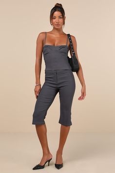 Everyone will envy your oh-so-chic look when you're wearing the Motel Sawil Charcoal Grey Mid-Rise Capri Trouser Pants! Stretchy woven fabric shapes these on-trend pants that have a mid-rise fit with a banded waist and a hidden zip fly with a top clasp closure. Fitted legs continue down to chic, capri-length hems with a slight flare. Pair with the matching top for a complete look! Fit: This garment fits true to size. Length: Knee Length. Size medium Inseam: 17.50 Front Rise: 9.00 Waist: Fitted - Chic Cropped Leg Summer Pants, Chic Cropped Leg Pants For Summer, Fitted Knee-length Bottoms For Day Out, Elegant Fitted Cropped Leg Capris, High Waist Capris For Summer, Chic Wide Leg Capris For Day Out, Chic Cropped Leg Bottoms For Summer, Chic Cropped Fitted Bottoms, Chic Fitted Cropped Bottoms