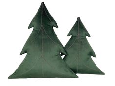 two green christmas trees sitting next to each other