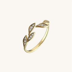 The Iconic Leaf Ring is an awesome integration of natural and modern style. The bold and enhanced sparkling stones increase its brilliance. It is perfect for everyday wear and wonderful gift for all kind of occasions. - Made in 14k solid gold - Decorated with handset white cubic zirconia stone on 14k solid gold - Band Width: 1.54 mm / 0.06 inches- Thickness: 1.11 mm / 0.04 inches -This product comes with iconic Norm Jewels gift box Elegant Cubic Zirconia Crystal Ring With Half Eternity Detail, Elegant Cubic Zirconia Half Eternity Crystal Ring, Elegant Open Ring With Half Eternity Detail, Elegant Open Ring With Half Eternity Design, Elegant Open Ring With Half Eternity, Elegant White Gold Crystal Half Eternity Ring, Elegant Yellow Gold Stackable Rings With Cubic Zirconia, Elegant Half Eternity Crystal Ring With Round Band, Dazzling 14k Gold Open Ring