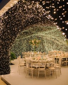 an instagram photo with lights on the ceiling and tables set up for a party