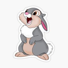 a cartoon rabbit sitting on the ground with its mouth open and it's tongue out