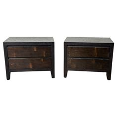 a pair of nightstands made out of wood and leather