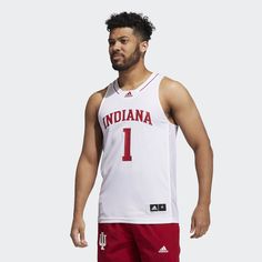 adidas Hoosiers fans are some of the most die-hard supporters in basketball. Show your Indiana University pride in this adidas V-neck jersey. It's styled after the team's uniform with screenprinted details on the front and back. AEROREADY keeps you dry on the court or in the stands.This product is made with Primegreen, a series of high-performance recycled materials. Indiana University, Team Uniforms, Die Hard, Mens Basketball, Adidas Online, The Court, Recycled Materials, Ncaa, Indiana