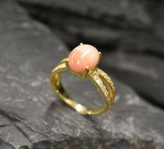 Coral Ring set with a Natural Angel Skin Coral in the highest grade, natural patterns & pale pink color, from Italy, at 10x8mm, 3 Carats. Together with small CZ Diamonds on the band. Natural Coral Ring made of Solid 925 Sterling Silver ☞ made to last. **The ring is plated with 18K Gold (the thickest plating - 3 Micron) over Solid 925 Sterling Silver. Matching Earrings: www.etsy.com/uk/listing/763926083 Matching Pendant - please ask me ☞ Choose your size ☞ I resize (before shipping) for FREE to A Engagement Ring Gold Vintage, Gold Vintage Ring, Engagement Ring Gold, Angel Skin, Coral Ring, Natural Coral, Coral Jewelry, March Birthstone, Citrine Ring