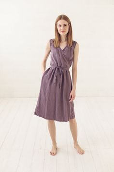 "DETAILS * Linen wrap dress with stylish long belt * Two side pockets for your comfort * Sleeveless light dress make feel fresh in all warm days * Made from soft wash medium weight (185 g) 100 % European linen fabric * Height of the model is 177 cm (5' 8\") and she is wearing size XS/S dress in violet ash color * The full length of linen dress is +/- 110 cm/ 43.3\" * Please choose desired color and size on the right * Product number: D32 CARE LABEL * machine wash gentle (40 C/104 F) * dry gentle Casual Sleeveless V-neck Dress With Tie Waist, Casual Linen Wrap Dress With Tie Waist, Casual Sleeveless Wrap Dress For Summer, Casual Sleeveless Wrap Dress For Beach, Casual Sleeveless Beach Wrap Dress, Sleeveless Linen Dress With Tie Fastening, Casual Sleeveless Linen Dress With Tie Waist, Casual Wrap Dress With Tie Waist, Casual Wrap Midi Dress With Tie Waist