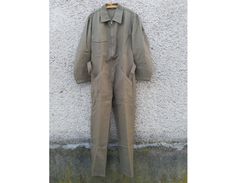 "Absolutely fantastic unused vintage Swiss army light brown-green coverall jumpsuit. Good military uniform of high quality materials and in excellent condition. Suitable for both fashionable upgrades or for work wear). MOD. DEP Please see detailed measurements below to ensure the desired fit. If you have any questions regarding the size or state of a particular combination, please contact. CONDITION: NEW unused condition, detail in the photo. MEASUREMENTS: Size 50 Shoulders: 49cm (19.3\") Arm Le Khaki Cotton Long Sleeve Jumpsuits And Rompers, Khaki Utility Overalls For Workwear, Khaki Cotton Utility Overalls, Khaki Utility Overall Jumpsuits And Rompers, Military Style Khaki Jumpsuit, Khaki Long Sleeve Utility Overalls, Khaki Military Style Long Sleeve Jumpsuits, Military Style Long Sleeve Khaki Jumpsuit, Khaki Military Long Sleeve Jumpsuit