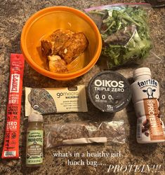 an assortment of food is laid out on the counter