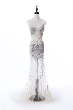 The beading on this elegant evening gown will surely light up a stage in any competition. Glamorous Ball Gown For Pageants, Glamorous Ball Gown For Pageant, Glamorous Evening Dress With Long Train, Pageant Evening Dress With Sweep Train And Fitted Bodice, Floor-length Evening Dress With Fitted Bodice For Pageants, Glamorous Evening Dress With Sequins And Long Train, Elegant Ball Gown For Prom And Pageant, Glamorous Gown With Fitted Bodice For Pageants, Glamorous Ball Gown Evening Dress For Pageants