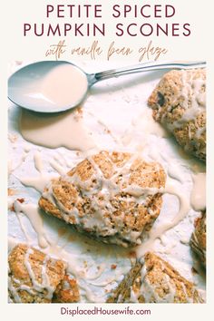 a white plate topped with scones covered in frosting