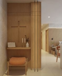 the interior of a modern home with wood paneling and white tile flooring on the walls