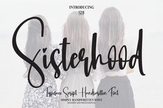 three girls standing together with the word sisterhood written in black on top of them