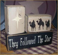 two blocks with the words they followed the star and three wise men riding camels