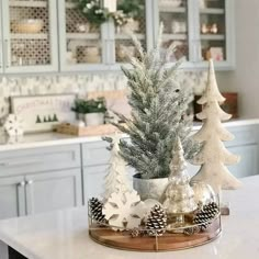 a kitchen counter topped with christmas trees and snowflakes on top of it