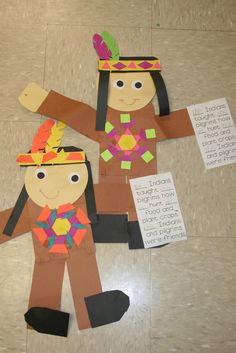 two paper dolls made to look like native americans