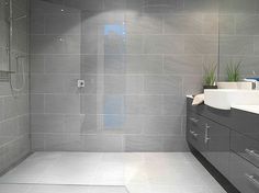 a modern bathroom with gray tile walls and floor