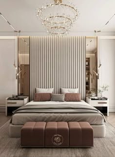 a bedroom with a large bed and a chandelier hanging from the ceiling above it