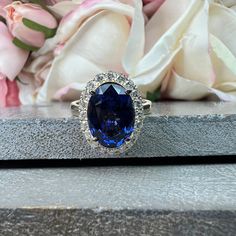 "This ring is an elongated oval cut lab created blue sapphire with round natural diamond halo made with pure 14k white gold item #5627 youtube: https://www.youtube.com/watch?v=3vX1vKn1huw -Total carat weight: approx. - 4.58ctw diamond equivalent -Center Stone Size: 12x9mm - approx 4.00ct diamond equivalent -Gem Type: Lab Created Blue Sapphire -Center Stone Shape: Elongated Oval Cut -Center Stone Clarity: VS2 -Center Stone Color: Royal Blue - Hardness: 9 Mohs scale -Accent Stones: Natural Diamond Kate Middleton Jewelry, Future Engagement Rings, White Gold Set, Halo Setting, Plain Bands, 14k Gold Ring, Engagement Ring Styles, Diamond Studs, Halo Diamond