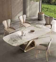 a dining table with chairs around it and a vase on the floor next to it