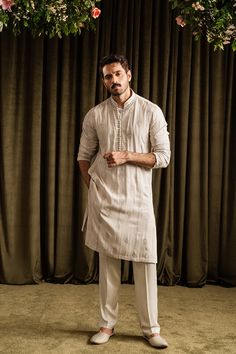 A luxurious, mid-thigh olive-gold toned kurta and pajama set with linear traditional motif embroidery detailed with tilla.   Color: Olive Gold Fabric: Cotton Luxe Blend  wajaj ali latest outfits, wahaj latest wardrobe, wahaj outfit 2024, Motif Embroidery, Sherwani For Men, Gold Fabric