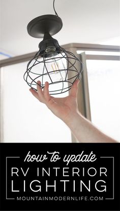 a hand holding a light fixture with the words how to update rv interior lighting