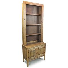 an old wooden bookcase with two doors and drawers on one side, against a white background