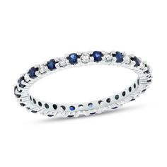 Sapphire and Diamond Eternity Band Ring in 14k White Gold. The round sapphire in this ring have a total carat weight of 0.30 carats. The diamonds have a total carat weight of 0.25 carats. Channel Set Sapphire Diamond Ring, Round Sapphire Color Diamond Ring Channel Set, Round Sapphire Diamond Ring With Channel Set, Fine Jewelry Round Sapphire Ring With Channel Set, Fine Jewelry Sapphire Ring With Channel Set, Sapphire Stackable Diamond Ring, Stackable Sapphire Diamond Ring, White Gold Sapphire Eternity Band, Classic Stackable Round Sapphire Ring