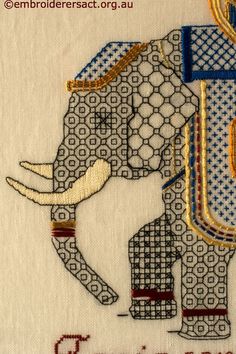 an elephant is embroidered onto the side of a piece of cloth