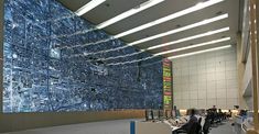 a large blue wall in an airport lobby