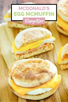 an egg mcmuffin sandwich cut in half on a cutting board