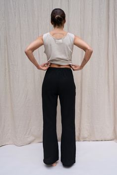 The Cove Pant is perfect for loungewear enthusiasts seeking something lighter and crisper this summer. Crafted from linen cotton crinkle fabric, it features a texture reminiscent of rippled water. With a high-waisted elastic waistband, relaxed flare-legged fit, and pockets, these pants are as comfortable as they are stylish. Depending on your height, they can sit at the ankle or be worn long and loose. Pair the Cove Pant with our Lilo Shirt or Bali Robe (Short) for a dramatic yet effortless look Summer Relaxation Sweatpants With Elastic Waistband, Effortless High-waisted Loungewear Pants, Relaxed Straight Bottoms With Elastic Waistband, Straight Leg Bottoms With Elastic Waistband, Straight Leg Bottoms With Elastic Waistband For Casual Wear, Straight Leg Bottoms With Elastic Waistband For Relaxation, Relaxation Straight Pants With Elastic Waistband, Relaxation Straight Bottoms With Elastic Waistband, Cotton Wide Leg Ankle-length Pants For Lounging