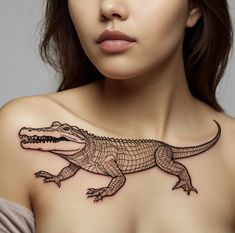 a woman with a tattoo on her chest is looking at the camera and she has an alligator