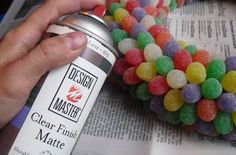 a person is holding a can of jelly beans