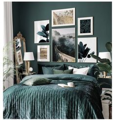 a bedroom with green walls and pictures on the wall above it, along with a bed