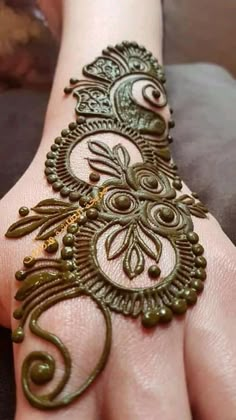 the hand is decorated with an intricate design