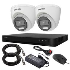 two security cameras sitting on top of a black box next to a mouse and wires