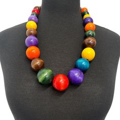 Elevate your style with this stunning multicoloured wooden necklace, a true piece of African jewellery. The necklace features a unique design with a mix of vibrant colours that will make you stand out in any occasion. Crafted from high-quality wood, this necklace is durable and long-lasting. The beaded style of this necklace adds a touch of elegance to any outfit, making it perfect for both casual and formal events.  Size:  23 inches in length with elastic cord. Colours: Multicolour Weight: 180g Material: Wood African Jewellery, Necklace African, Ethnic Necklaces, Hippie Necklace, Wooden Necklace, African Jewelry, Outfit Making, Beaded Necklaces, Vibrant Colours