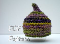 there is a knitted hat on top of a plastic cup with the word pop pattern written below it